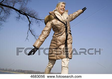 Woman balancing outdoor View Large Photo Image Stock Photograph - Woman balancing outdoor . Fotosearch