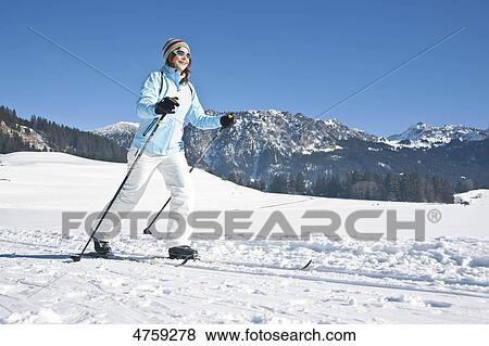 Stock Photo - Woman cross-country skiing, Tannheimer Tal, Tyrol, Austria . Fotosearch