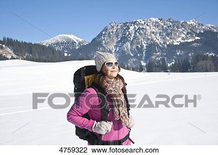 Woman hiking in snow, Tannheimer Tal, Tyrol, Austria View Large Photo Image Stock Image - Woman hiking in snow, Tannheimer Tal, Tyrol, Austria . Fotosearch