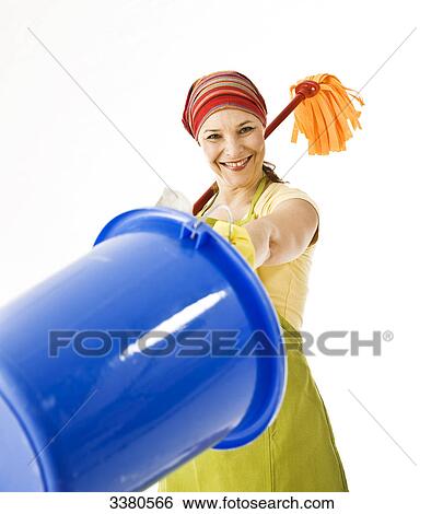 Woman holding mop and cleaning bucket View Large Photo Image Stock Photograph - Woman holding mop and cleaning bucket . Fotosearch