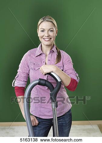 Stock Photo - Woman hoovering . Fotosearch