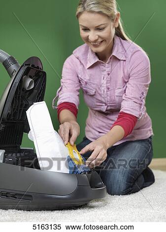 Woman hoovering View Large Photo Image Stock Photography - Woman hoovering . Fotosearch