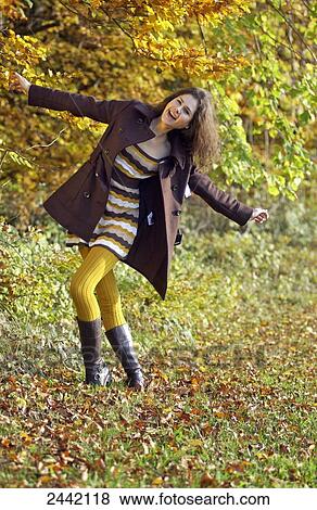 Stock Photo - Woman in park . Fotosearch