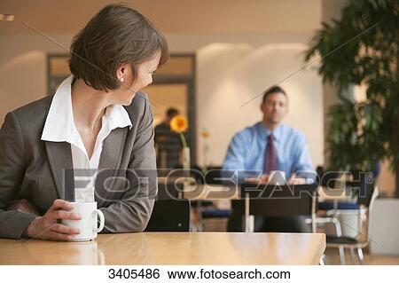 Stock Photograph - Woman looking over her shoulder . Fotosearch