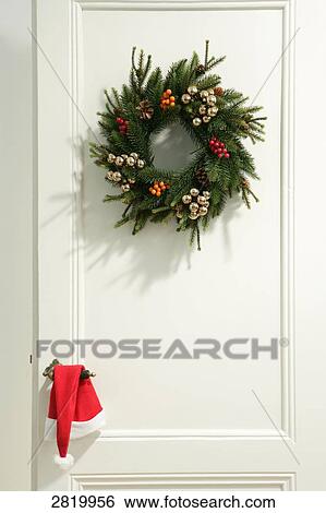Wreath hanging on door View Large Photo Image Stock Photograph - Wreath hanging on door . Fotosearch