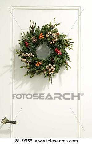 Stock Photography - Wreath hanging on door . Fotosearch