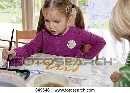 Young boy and girl painting in the kindergarten View Large Photo Image Stock Image - Young boy and girl painting in the kindergarten . Fotosearch