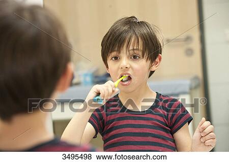 Young boy brushing his teeth View Large Photo Image Stock Photo - Young boy brushing his teeth . Fotosearch