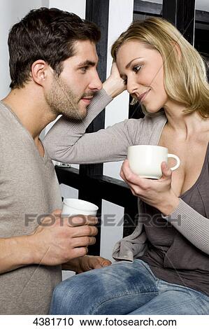 Young couple in kitchen View Large Photo Image Stock Image - Young couple in kitchen . Fotosearch