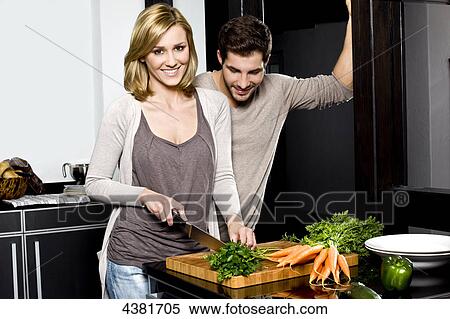 Young couple in kitchen View Large Photo Image Stock Photography - Young couple in kitchen . Fotosearch