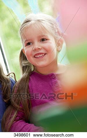 Young girls in a kindergarten, low angle view View Large Photo Image Stock Image - Young girls in a kindergarten, low angle view . Fotosearch