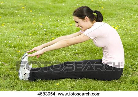 Picture - Young woman doing workout . Fotosearch