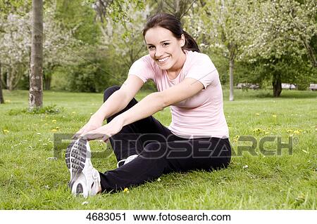 Stock Image - Young woman doing workout . Fotosearch