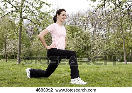 Stock Image - Young woman doing workout . Fotosearch