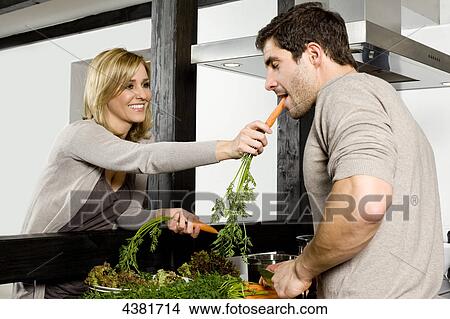 Young woman in kitchen View Large Photo Image Picture - Young woman in kitchen . Fotosearch