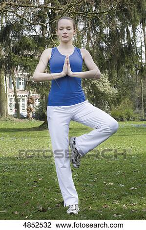 Stock Image - Young woman in yoga position . Fotosearch