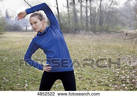 Stock Image - Young woman running . Fotosearch