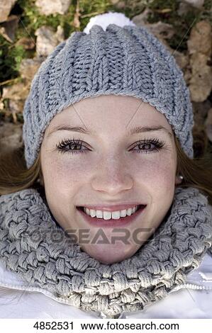 Young woman smiling at camera View Large Photo Image Stock Image - Young woman smiling at camera . Fotosearch