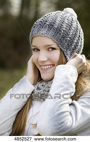 Young woman smiling at camera View Large Photo Image Stock Photo - Young woman smiling at camera . Fotosearch