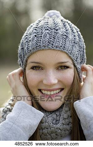Stock Photograph - Young woman smilng at camera . Fotosearch