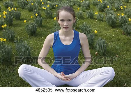Young woman yoga position View Large Photo Image Stock Photography - Young woman yoga position . Fotosearch