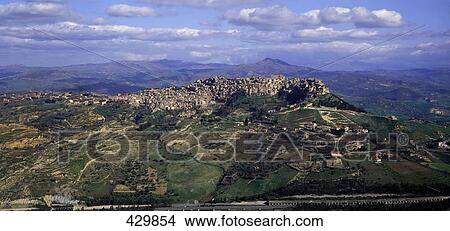 Picture - Aerial view of houses on hill, Calascibetts, Sicily, Italy . Fotosearch