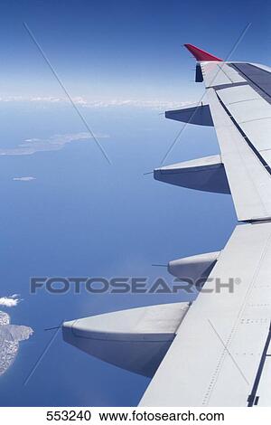 Stock Image - Airplane in flight . Fotosearch