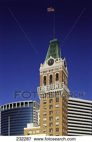 American flag fluttering on clock tower, Oakland, California, USA View Large Photo Image Stock Photo - American flag fluttering on clock tower, Oakland, California, USA . Fotosearch