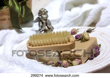 Bars of soaps and brush with dried rose buds on plate View Large Photo Image Picture - Bars of soaps and brush with dried rose buds on plate . Fotosearch