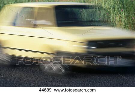 Blurred view of car on road View Large Photo Image Stock Photo - Blurred view of car on road . Fotosearch