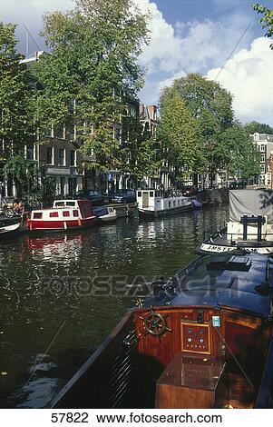 Stock Image - Boasts in canal, Prinsengracht, Amsterdam, Netherlands . Fotosearch