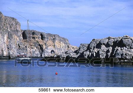 Stock Image - Boat in bay, Lidos Beach, Rhodes, Greece . Fotosearch