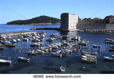 Stock Photo - Boats in front of fortress, St Ivan's Fortress, Dubrovnik, Dalmatia, Croatia . Fotosearch