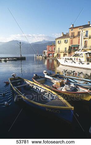 Stock Image - Boats in harbor, Lake Garda, Veneto, Italy . Fotosearch