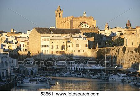 Stock Image - Boats in harbor with castle in background, Ciutadella, Minorca, Balearic Islands, Spain . Fotosearch