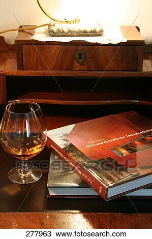 Books and glass of white wine on table  View Large Photo Image Stock Image - Books and glass of white wine on table . Fotosearch