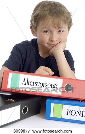 Stock Photo - Boy with a pile of files . Fotosearch