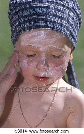 Boy with sun protection on face View Large Photo Image Picture - Boy with sun protection on face . Fotosearch