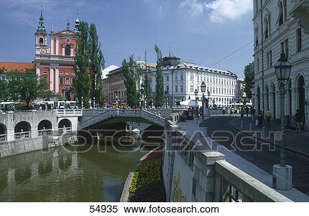 Stock Photography - Bridge across river in old part of town, Ljublijanica River, Ljubljana, Slovenia . Fotosearch