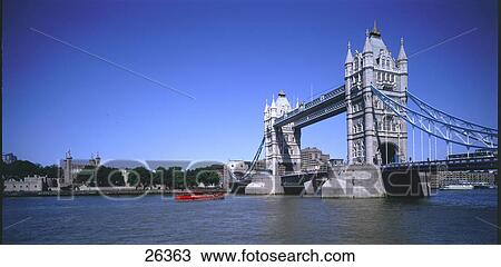 Stock Image - Bridge across river, Tower Bridge, Thames River, London, England . Fotosearch
