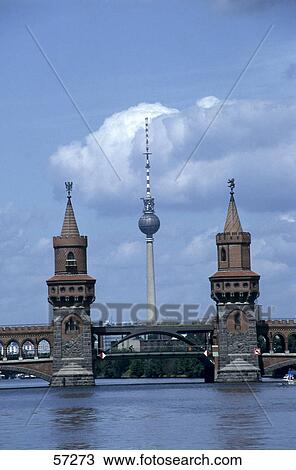 Bridge across river with TV tower in background, Oberbaum Bridge, Spree River, Berlin, Germany View Large Photo Image Stock Image - Bridge across river with TV tower in background, Oberbaum Bridge, Spree River, Berlin, Germany . Fotosearch