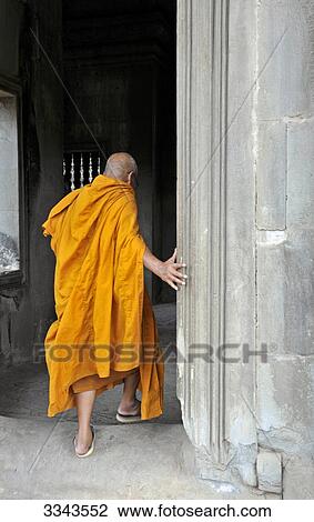 Buddhist monk in temple, Angkor Wat, Angkor, Cambodia, rear view View Large Photo Image Stock Image - Buddhist monk in temple, Angkor Wat, Angkor, Cambodia, rear view . Fotosearch