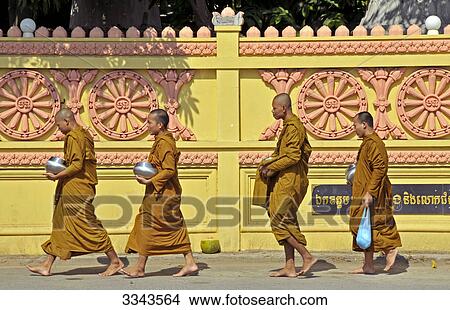 Buddhist monks carrying alms, side view View Large Photo Image Picture - Buddhist monks carrying alms, side view . Fotosearch