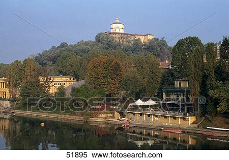Stock Photography - Buildings at waterfront, River Po, Monte Capuccino, Turin, Piedmont, Italy . Fotosearch