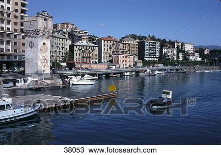 Stock Image - Buildings at waterfront, Savona, Cinque Terre, Liguria, Italy . Fotosearch