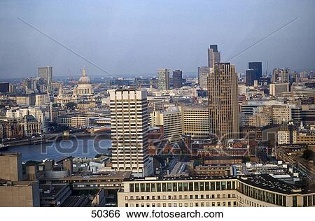 Stock Photograph - Buildings in city, Thames River, London, England . Fotosearch