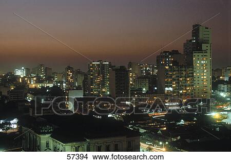 Picture - Buildings lit up in the city at night, Maputo, Mozambique . Fotosearch