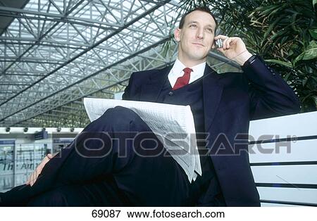 Stock Photo - Businessman talking on mobile phone . Fotosearch