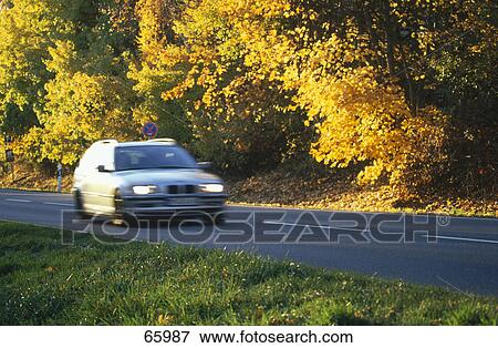 Car in motion on road View Large Photo Image Stock Photo - Car in motion on road . Fotosearch