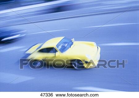 Stock Photograph - Car in motion on road . Fotosearch